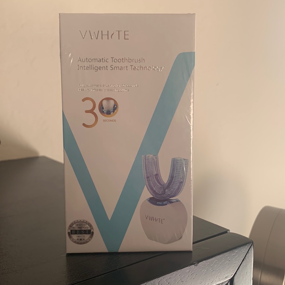 V white automatic toothbrush